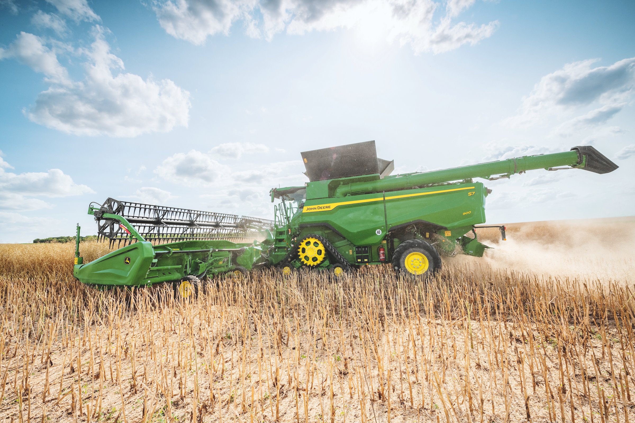 John deere s7 900 combine harvesting rapeseed 2400px wide